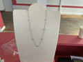 Collier doré et pendentif blanc