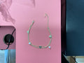 Chaîne de cheville doré double chaîne cœur et perle blanche