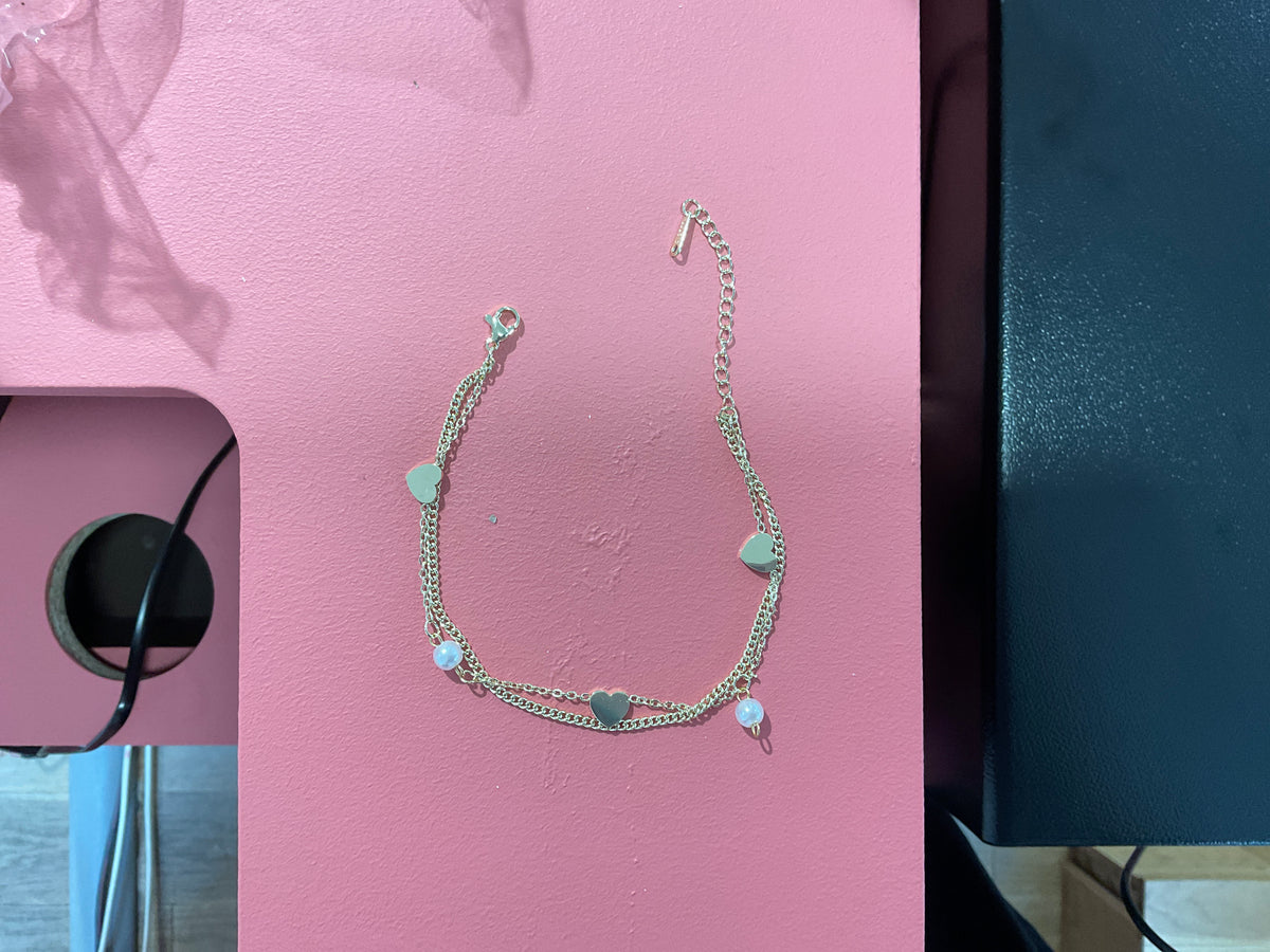 Chaîne de cheville doré double chaîne cœur et perle blanche